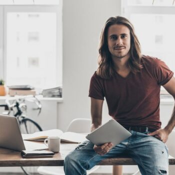 man with long hair at the office