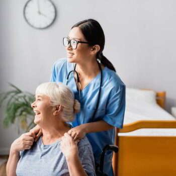 patient nurse with a disable elderly woman